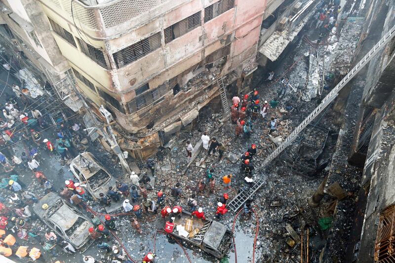 epaselect epa07384559 Firefighters inspect the aftermath of a fire that broke out in the Chawkbazar area of Old Dhaka, Bangladesh, 21 February 2019.  According to the local media reports, the death toll from the fire at a chemical warehouse in Chawkbazar area of Old Dhaka has now risen to 70, and among the injured, 41 were admitted to Dhaka Medical College Hospital.  EPA/MONIRUL ALAM