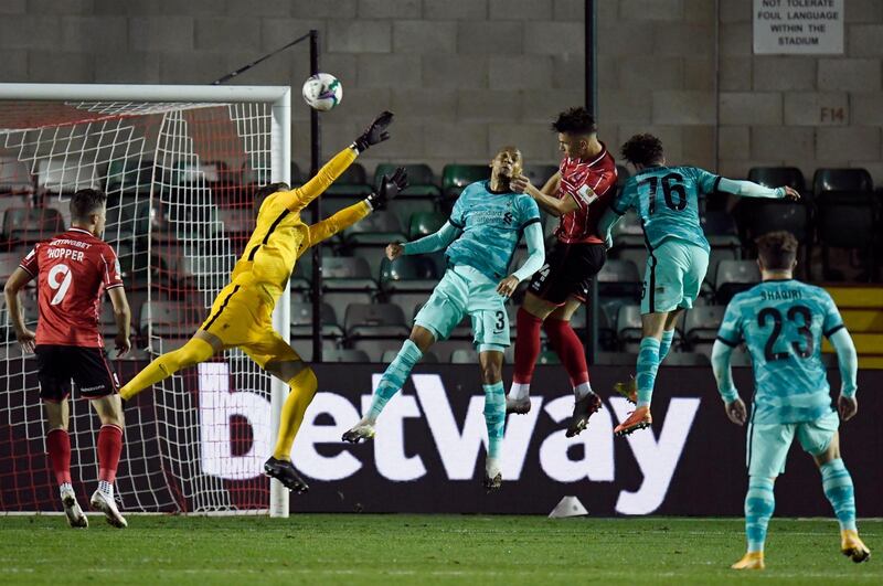 Lincoln City's Lewis Montsma, centre right, scores his team's second goal against Liverpool. EPA