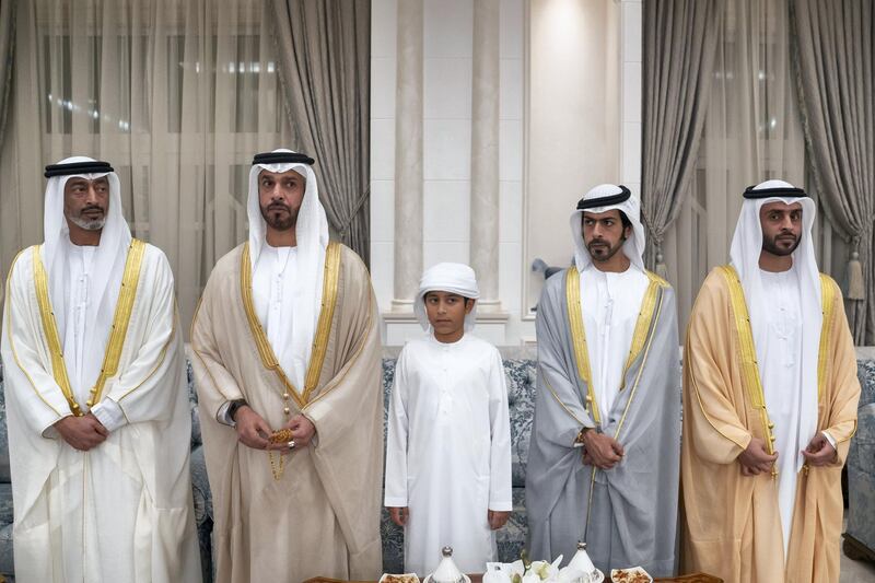 ABU DHABI, UNITED ARAB EMIRATES - June 04, 2019:  Rear Admiral Pilot HH Sheikh Saeed bin Hamdan bin Mohamed Al Nahyan, Commander of the UAE Naval Forces (L), HH Sheikh Khalifa bin Mohamed bin Khaled Al Nahyan (2nd L) and HH Sheikh Khalifa bin Tahnoon bin Mohamed Al Nahyan, Director of the Martyrs' Families' Affairs Office of the Abu Dhabi Crown Prince Court (4th L), attend an Eid Al Fitr reception at Mushrif Palace. 

( Eissa Al Hammadi for Ministry of Presidential Affairs )
---