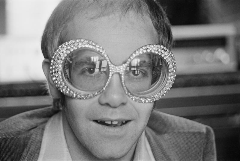 The singer-songwriter wearing a pair of his flamboyant trademark spectacles in 1974. Getty Images