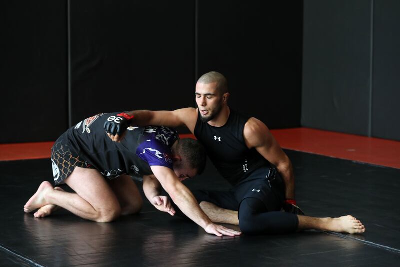 UFC fighter Muhammad Mokaev wrestles with Dean Garnett, his long-time Liverpudlian coach and confidant who only just touched down from the UK.