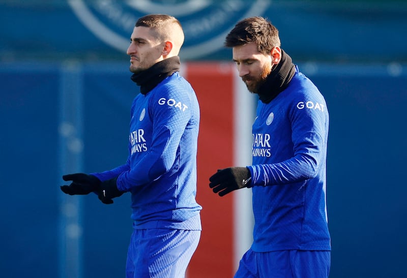 Soccer Football - Champions League - Paris St Germain Training - Ooredoo Training Centre, Saint-Germain-en-Laye, France - February 13, 2023 Paris St Germain's Marco Verratti and Lionel Messi during training REUTERS / Sarah Meyssonnier