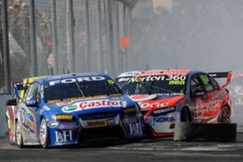 Mark Winterbottom shows his skills when driving the Ford Performance Racing car, left, through the first turn at the Surfers Paradise Street Circuit, Queensland in the V8 Supercar Championship Series in October.
