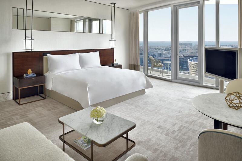 A premier room in the hotel, featuring floor-to-ceiling windows with views of Downtown Dubai