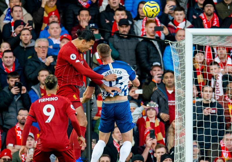 Liverpool's Virgil van Dijk scores the first goal against Brighton & Hove Albion Anfield. EPA