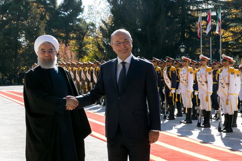 Iraq's President Barham Salih is welcomed by Iran's President Hassan Rouhani during his visit in Tehran. Reuters