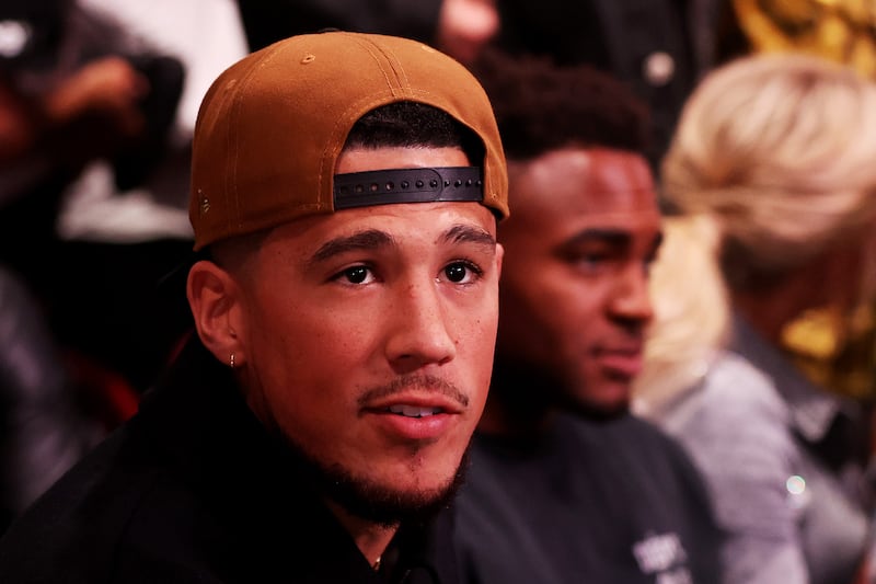 NBA player Devin Booker of the Phoenix Suns attends the fight between Jake Paul and Anderson Silva. AFP