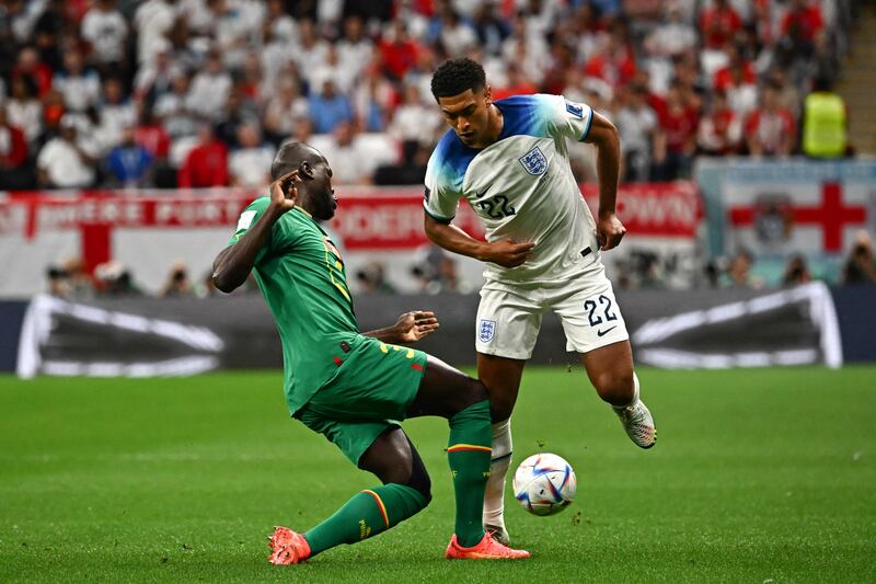 Senegal's Kalidou Koulibaly battles with England's Jude Bellingham. AFP
