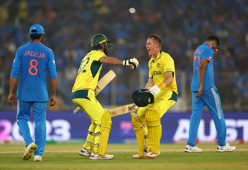 Australia's Glenn Maxwell and Marnus Labuschagne celebrate after secureing victory. Reuters