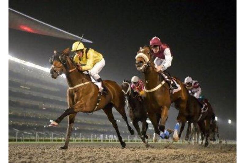 Alo Pura, left, ridden by William Buick, wins the Al Tayer Motors at Meydan Racecourse last night.