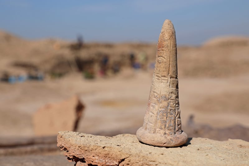 A cone bearing a cuneiform inscription. AFP