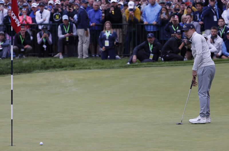 Matt Fitzpatrick of England putts on the 18th green during the final round of the 2022 US Open. EPA