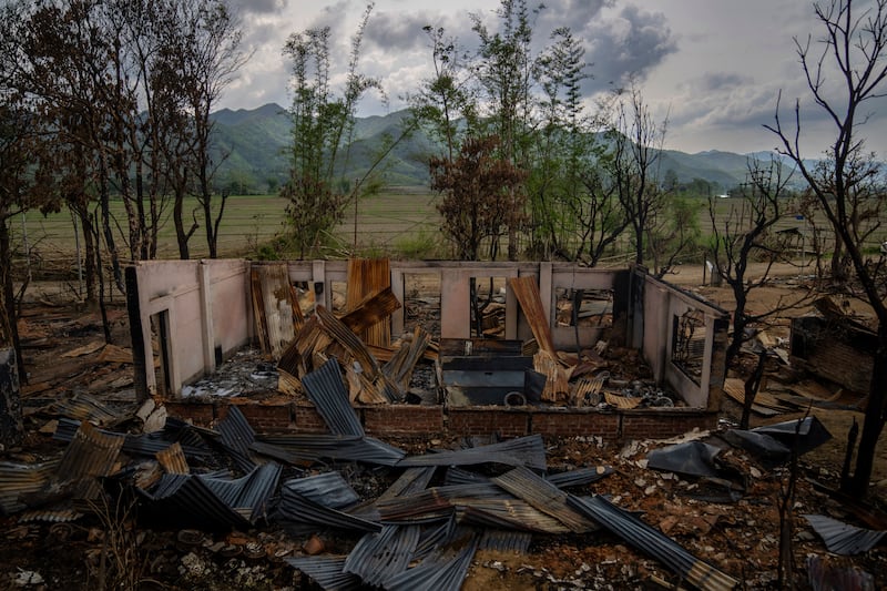 The shell of a burnt house after ethnic clashes and rioting in Sugnu, in the north-eastern Indian state of Manipur. AP