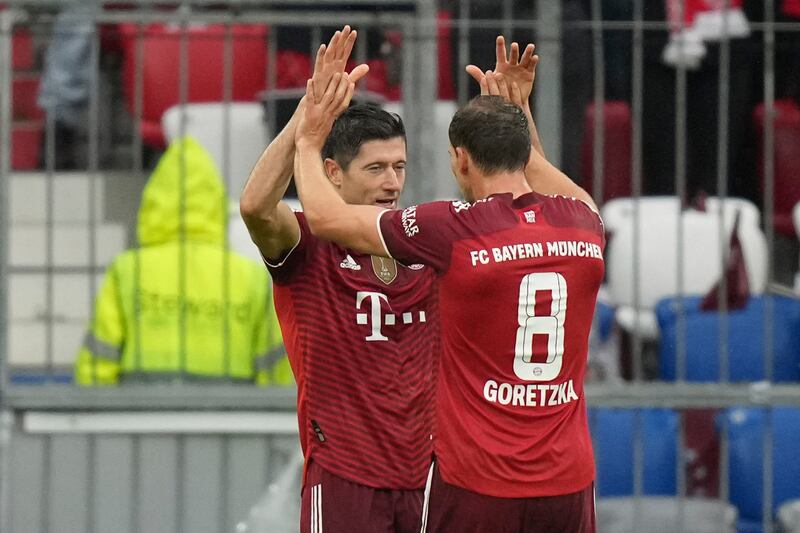 Lewandowski, left, celebrates after scoring his side's second goal. AP