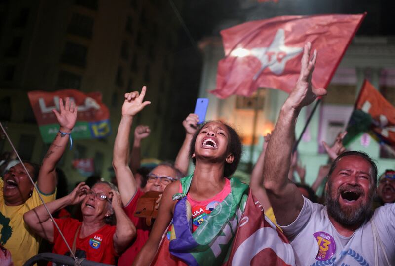 Supporters of Mr da Silva cheer his win. Reuters