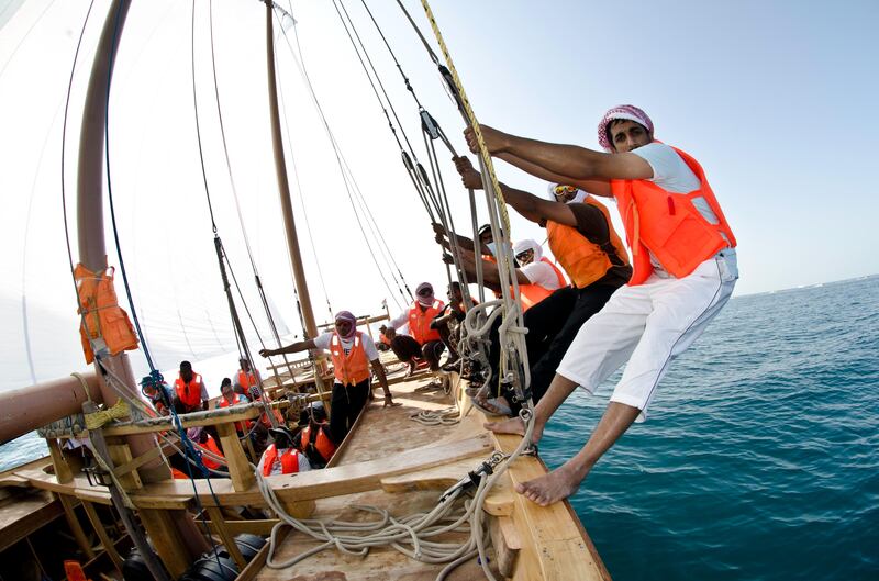 Volvo Ocean Race crew members compete in the The Abu Dhabi Sailing Festival Race in 60ft Dhow boats, during the Volvo Ocean Race 2011-12 in Abu Dhabi. (Photo Credit Must Read: MARC BOW/Volvo Ocean Race)