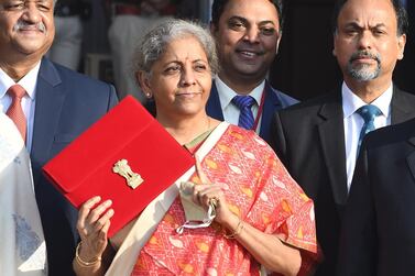 Indian finance minister Nirmala Sitharaman holds a folder containing Union Budget 2021 documents in New Delhi ahead of its presentation in the parliament. EPA
