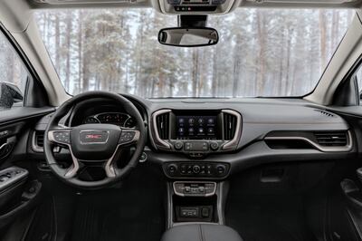 The updated interior with new Electronic Precision Shift and stop/start disable buttons. Photo: GMC 