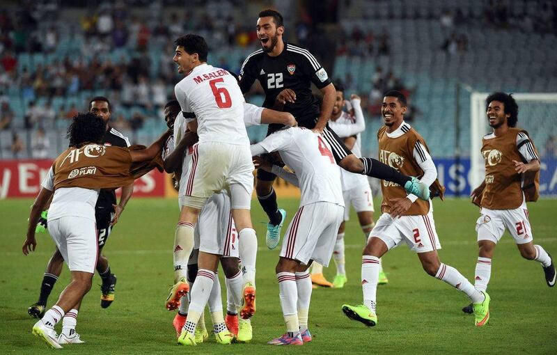 The UAE celebrate after beating Japan on penalties in the Asian Cup quarter-finals on Friday in Australia. They face the hosts in the semi-finals on Tuesday. Saeed Khan / AFP / January 23, 2015