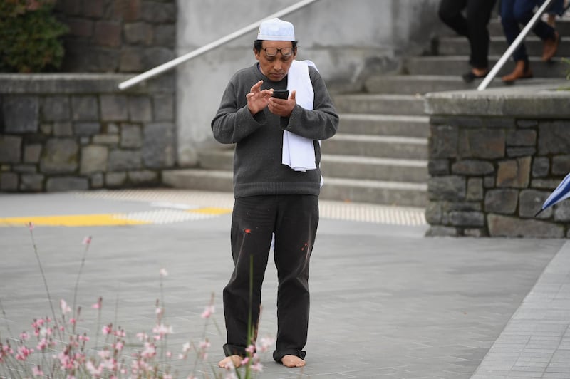 Hamzah Noor Yahaya, a survivor of the shootings at Al Noor mosque, stands in front of Christchurch Hospita. Getty Images