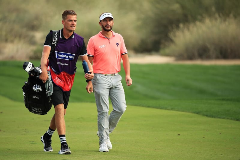 Joost Luiten of Netherlands and his caddy walk on the 16th hole. Getty Images