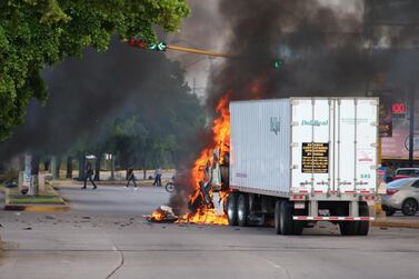 A lorry burns in the Mexican city of Culiacan in Sinaloa state after battles between security forces and heavily armed gunmen on October 17, 2019. AFP