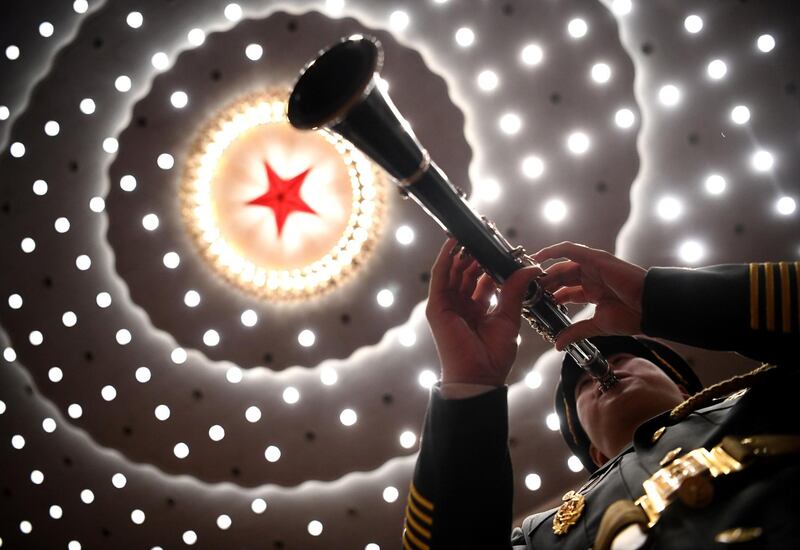 A musician plays his instrument during the ceremony to commemorate the 70th anniversary of China’s entry into the 1950-53 Korean War, at the Great Hall of the People in Beijing. AFP