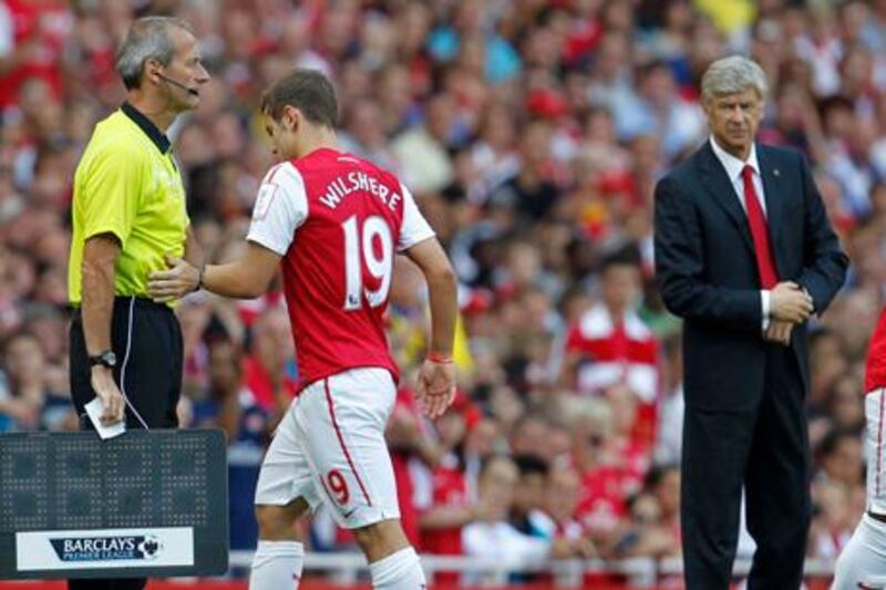 Football - Arsenal v New York Red Bulls Emirates Cup - Pre Season Friendly Tournament  - Emirates Stadium - 31/7/11
Arsenal's Jack Wilshere (C) goes off injured as manager Arsene Wenger (R) looks on
Mandatory Credit: Action Images / Jed Leicester
Livepic