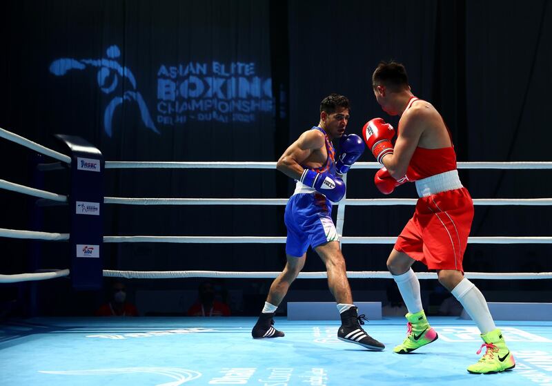 Kakmud Sabyrkhan of Kazakhstan (red) competes against Mohammed Uddin of India (blue). The event features 150 boxers from 17 countries. Getty Images