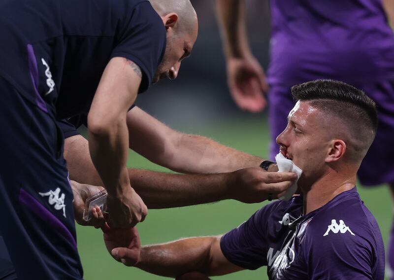 Luka Jovic of Fiorentina receives medical treatment after he was injured. EPA