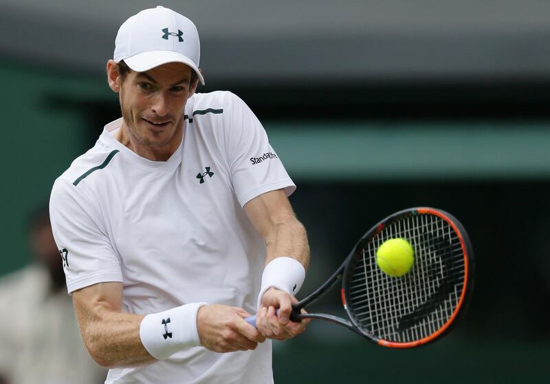 FILE - In this Wednesday, July 12, 2017 file photo, Britain's Andy Murray returns to Sam Querrey of the United States during their Men's Singles Quarterfinal Match on day nine at the Wimbledon Tennis Championships in London. Andy Murray has pulled out of next week's Western & Southern Open in Cincinnati because of an ongoing hip injury, Wednesday, Aug. 9, 2017. (AP Photo/Tim Ireland, File)