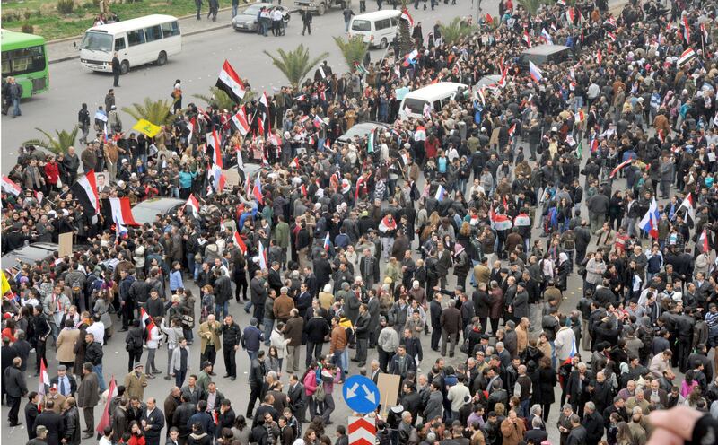 Supporters of Syrian President Bashar al-Assad gather on a Damascus street, to welcome Russian Foreign Minister Sergei Lavrov, February 7, 2012, in this handout photograph released by Syria's national news agency SANA. Lavrov began talks with Syrian President Bashar al-Assad on Tuesday by saying Moscow wants Arab peoples to live in peace and the Syrian leader is aware of his responsibility, Russian news agency RIA reported.          REUTERS/SANA (SYRIA - Tags: POLITICS) FOR EDITORIAL USE ONLY. NOT FOR SALE FOR MARKETING OR ADVERTISING CAMPAIGNS. THIS IMAGE HAS BEEN SUPPLIED BY A THIRD PARTY. IT IS DISTRIBUTED, EXACTLY AS RECEIVED BY REUTERS, AS A SERVICE TO CLIENTS *** Local Caption ***  SYR03_SYRIA-RUSSIA-_0207_11.JPG