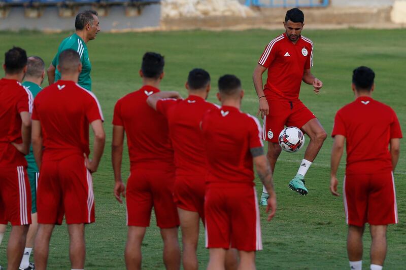 Mahrez controls the ball as his teammates watch on. AP Photo