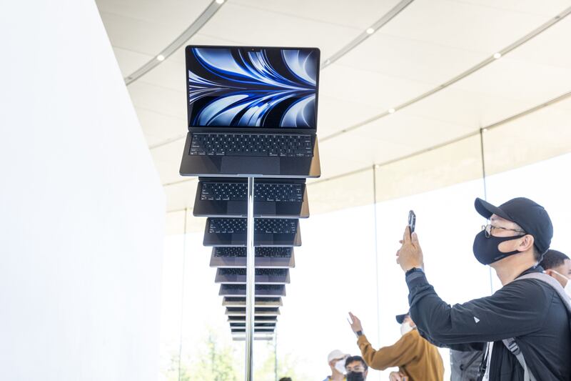 Guests view the new MacBook Air, powered by the M2 chip, during the Apple Worldwide Developers Conference at Apple Park in Cupertino. Bloomberg