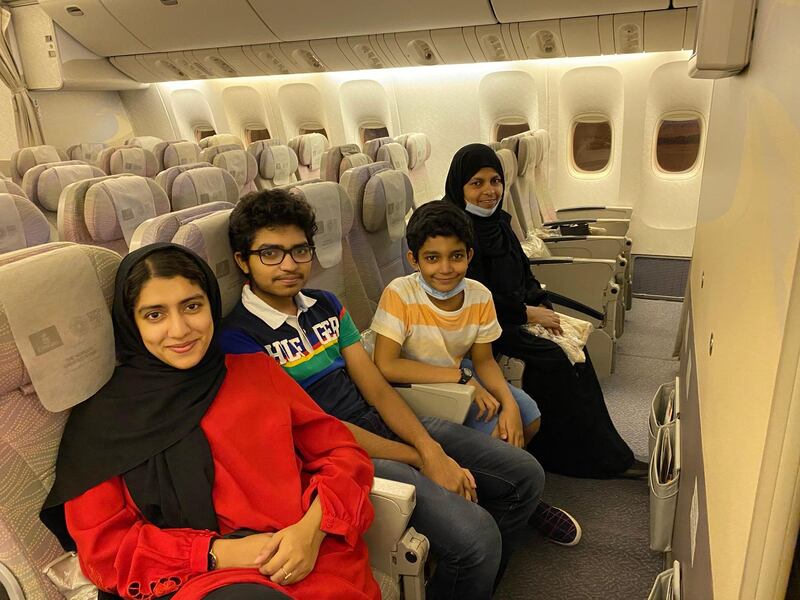 The family bought economy tickets but were allowed to sit in business class, where they were each assigned a cabin crew member to look after them.