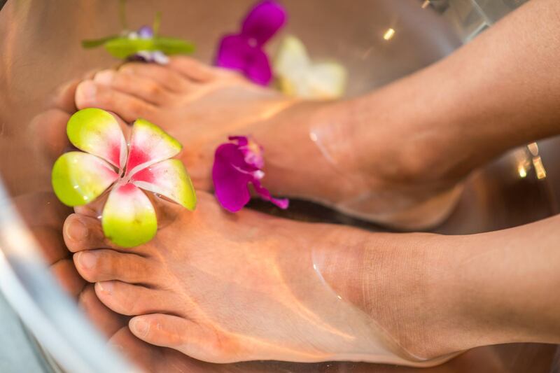 Recreate a spa experience at home with a fragrant foot bath. Unsplash 