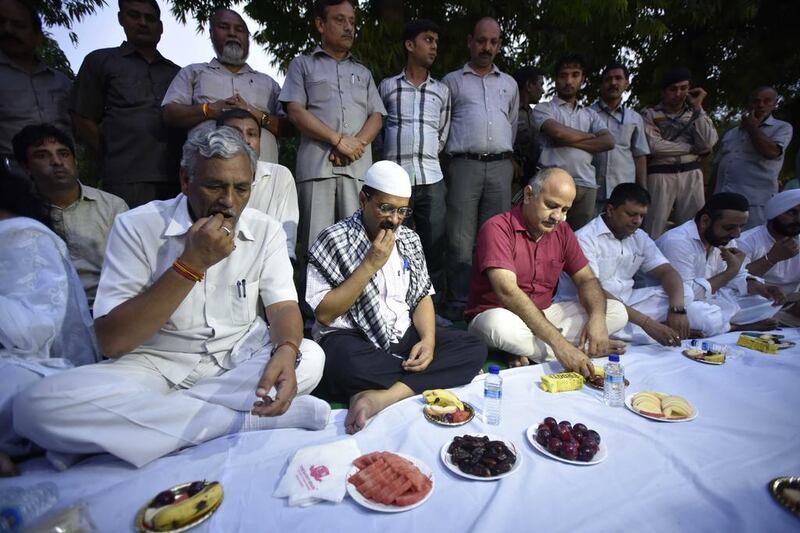 Delhi chief minister Arvind Kejriwal and deputy chief minister Manish Sisodia, and other members of their Aam Aadmi Party, host an iftar event in New Delhi on June 26, 2016. Arun Sharma / Hindustan Times via Getty Images