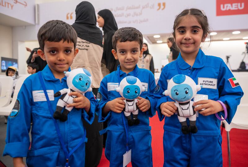 Pupils hold Suhail, the space mascot of the Mohammed Bin Rashid Space Centre