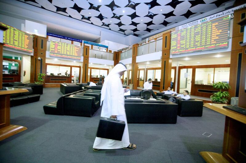 The Dubai Financial Market at the close of the day. Foreign investors bought $718.9 million worth of UAE shares in the first 11 months of the year, up from $202.97m in the same period last year. Randi Sokoloff / The National