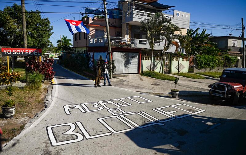 A sign written on the pavement in Santa Clara reads: 'Down with the blockade.' AFP