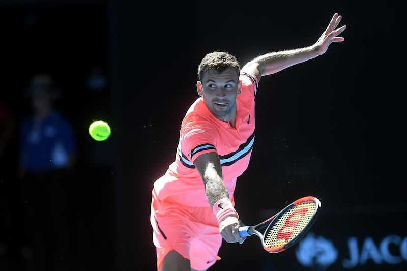 epa06439691 Grigor Dimitrov of Bulgaria in action against Dennis Novak of Austria during round one of the Australian Open tennis tournament in Melbourne, Australia, 15 January 2018.  EPA/JULIAN SMITH  AUSTRALIA AND NEW ZEALAND OUT