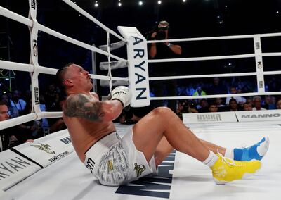 Oleksandr Usyk hits the canvas but the shot from Daniel Dubois was deemed a low blow. Reuters