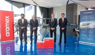 Aramex and Regent officials signed an agreement to develop electric seagliders for middle-mile logistics. Photo: Aramex 