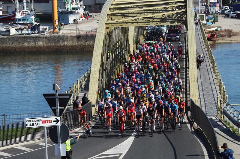The peloton crosses a bridge during Stage 10 of the Vuelta a Espana, 185km from Castro Urdiales to Suances, on Friday, October 30. EPA