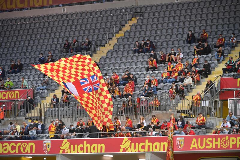 Supporters wearing face masks at the Felix Bollaert-Delelis stadium in Lens. AFP