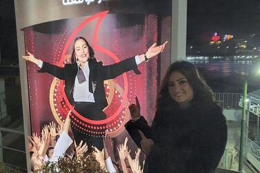 Egyptian actress Bushra points to an advertisement of the Vodafone TV commercial starring 'Fawazeer Ramadan' star Sherihan. Photo courtesy: Bushra