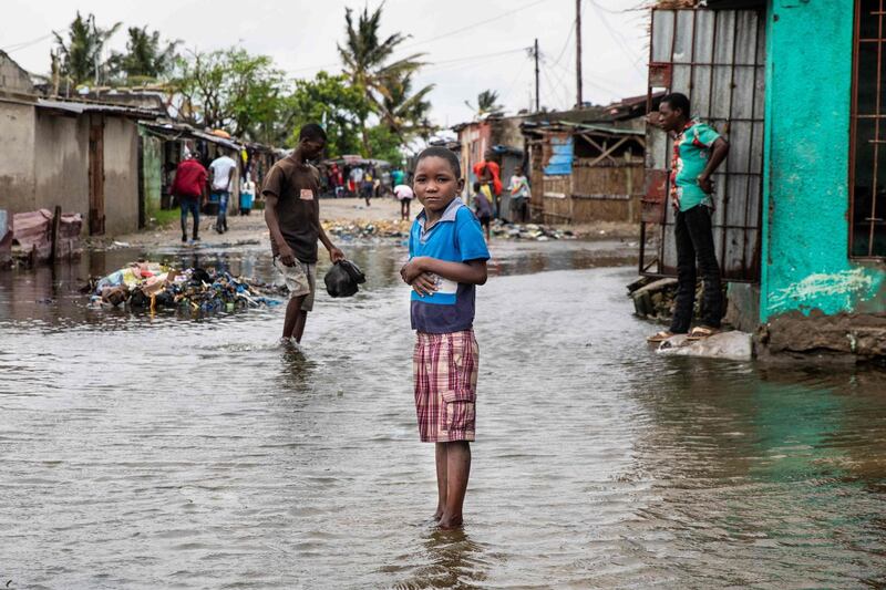 TOPSHOT - This handout picture released by UNICEF shows residents preparing themselves for the arrival of Cyclone Eloise, in the neighbourhood of Praia Nova, in Beira, on January 22, 2021. Tropical Cyclone Eloise made landfall around 2:30am on January 23, with wind speeds of 160 kilometres per hour. The worst of the storm's winds are over, but flooding remains a major threat in the days to come. With many key communications systems down, UNICEF emergency teams are on the ground assessing the situation to design quick and efficient relief response. The immediate identified needs are shelter, food, water, medical attention and the protection of children from abuse and exploitation, UNICEF said.

 - RESTRICTED TO EDITORIAL USE - MANDATORY CREDIT "AFP PHOTO/ UNICEF / RICARDO FRANCO" - NO MARKETING - NO ADVERTISING CAMPAIGNS - DISTRIBUTED AS A SERVICE TO CLIENTS
 / AFP / UNICEF / - / RESTRICTED TO EDITORIAL USE - MANDATORY CREDIT "AFP PHOTO/ UNICEF / RICARDO FRANCO" - NO MARKETING - NO ADVERTISING CAMPAIGNS - DISTRIBUTED AS A SERVICE TO CLIENTS
