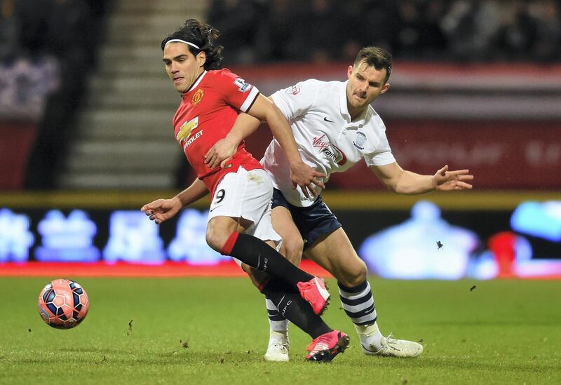 PRESTON, ENGLAND - FEBRUARY 16:  Radamel Falcao García of Manchester United and Bailey Wright of Preston North End battle for the ball during the FA Cup Fifth round match between Preston North End and Manchester United at Deepdale on February 16, 2015 in Preston, England  (Photo by Michael Regan/Getty Images)