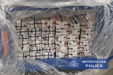 Bundles of cash seized during police operations in the UK after French and Dutch police broke open a criminal communications network. Metropolitan Police. 