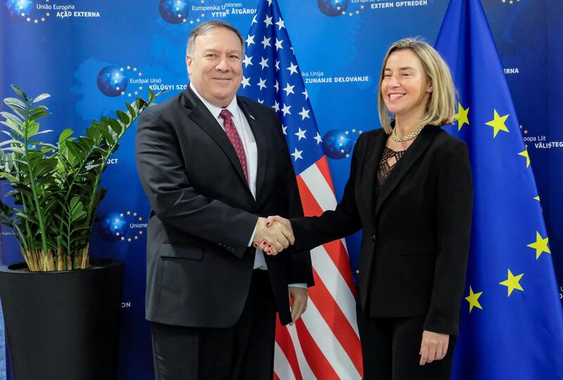 U.S. Secretary of State Mike Pompeo poses with European Union foreign policy chief Federica Mogherini in Brussels, Belgium February 15, 2019.  Olivier Hoslet/Pool via REUTERS